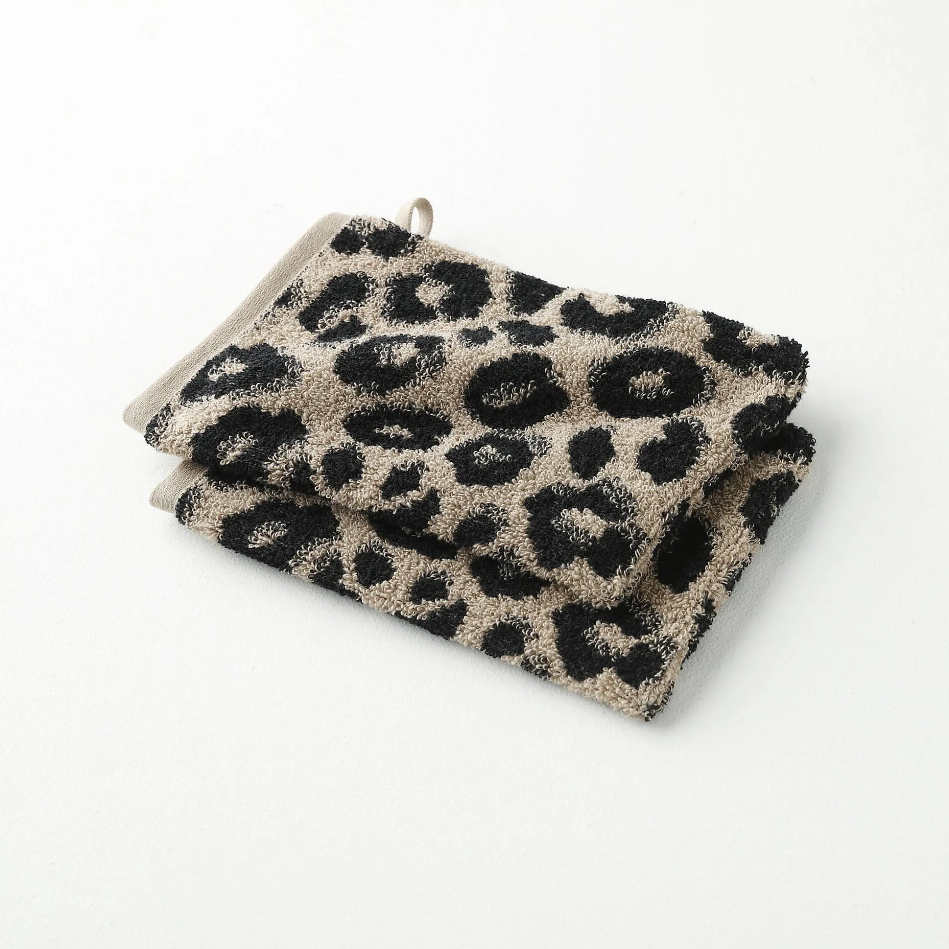 Collectie handdoeken in jacquard met luipaardhuidmotief 450 g/m2
