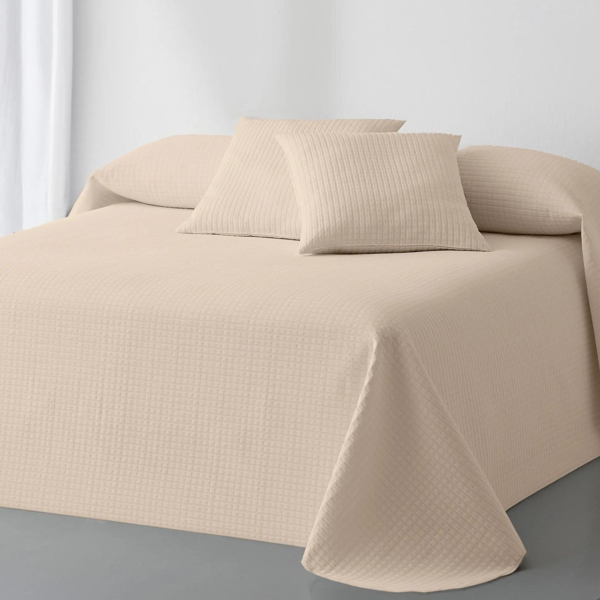 Effen bedsprei met gewafeld effect