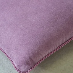 Effen kussen in velours met fantasieafwerking