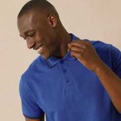 Effen polo in piquétricot met korte mouwen
