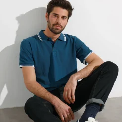 Effen polo in piquétricot met korte mouwen