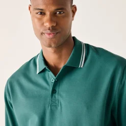 Effen polo in piquétricot met lange mouwen