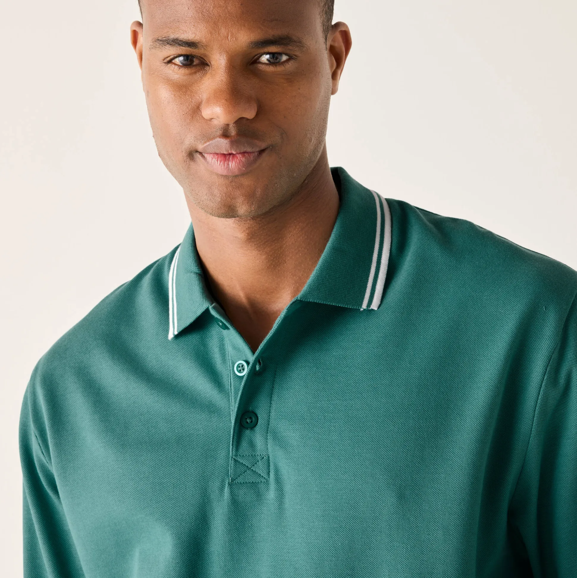 Effen polo in piquétricot met lange mouwen