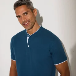 Effen polo in piquétricot, met maokraagje en korte mouwen