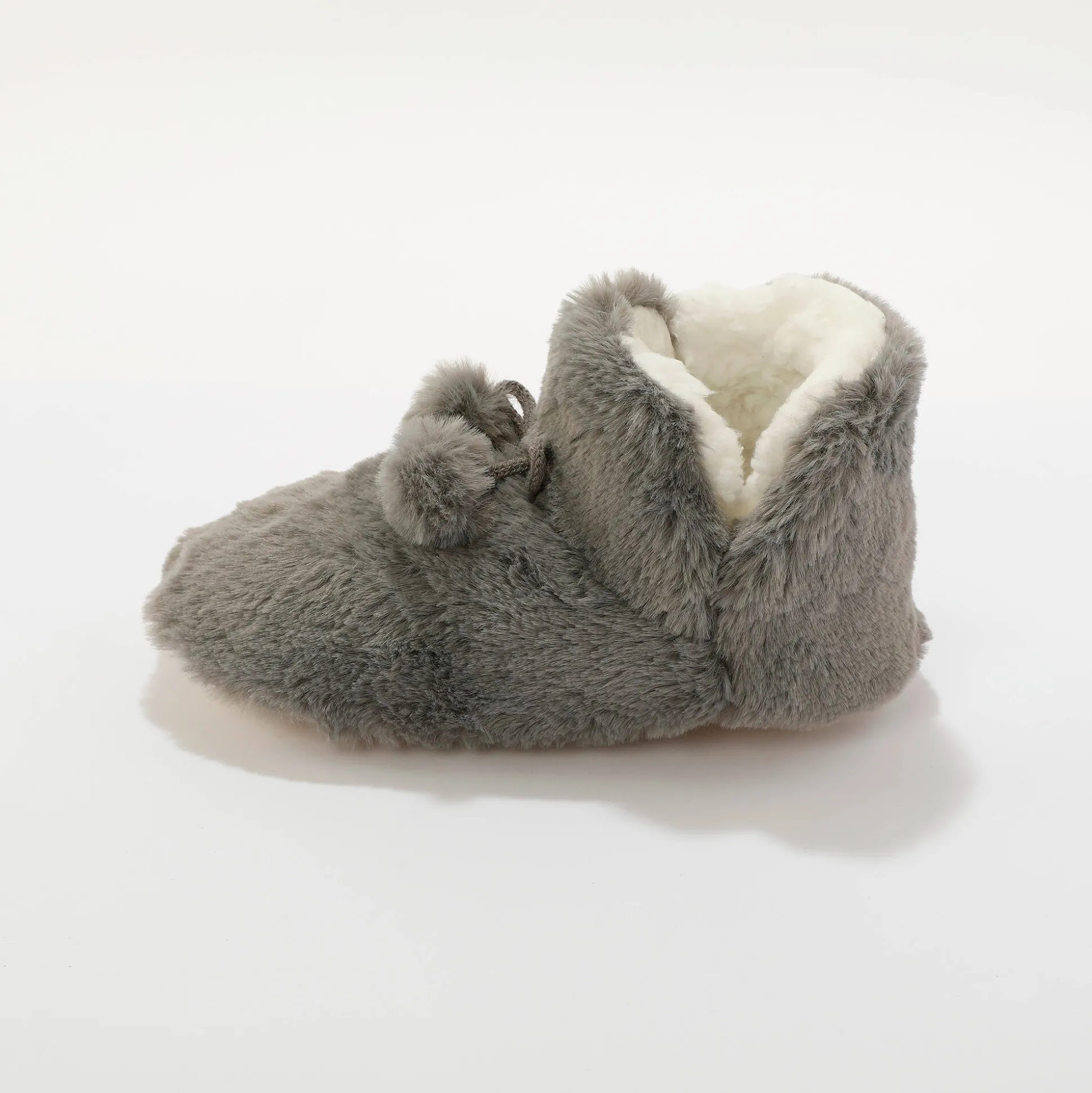 Pantoffels in laarsmodel met pompons en nepbontaspect
