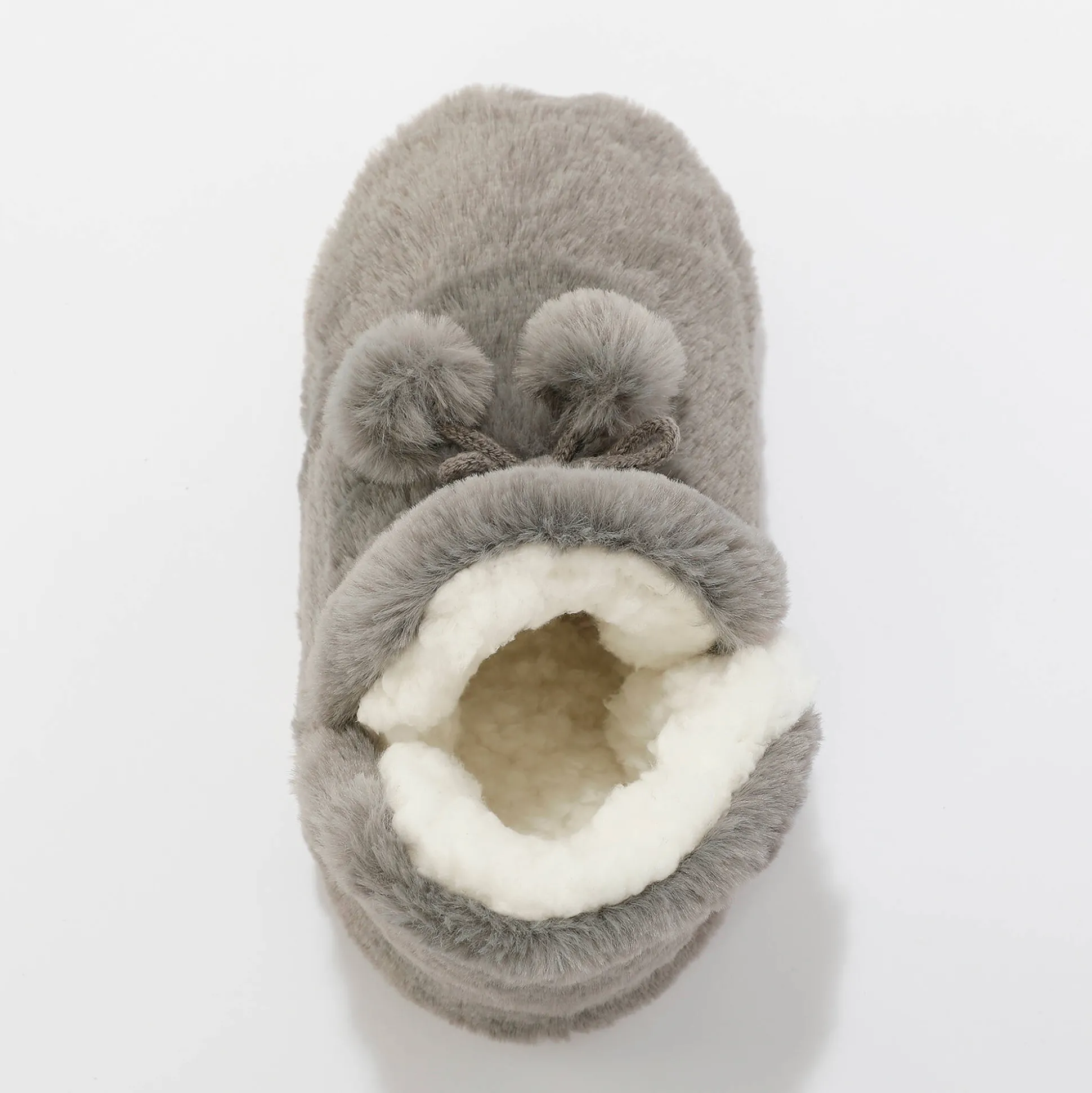 Pantoffels in laarsmodel met pompons en nepbontaspect