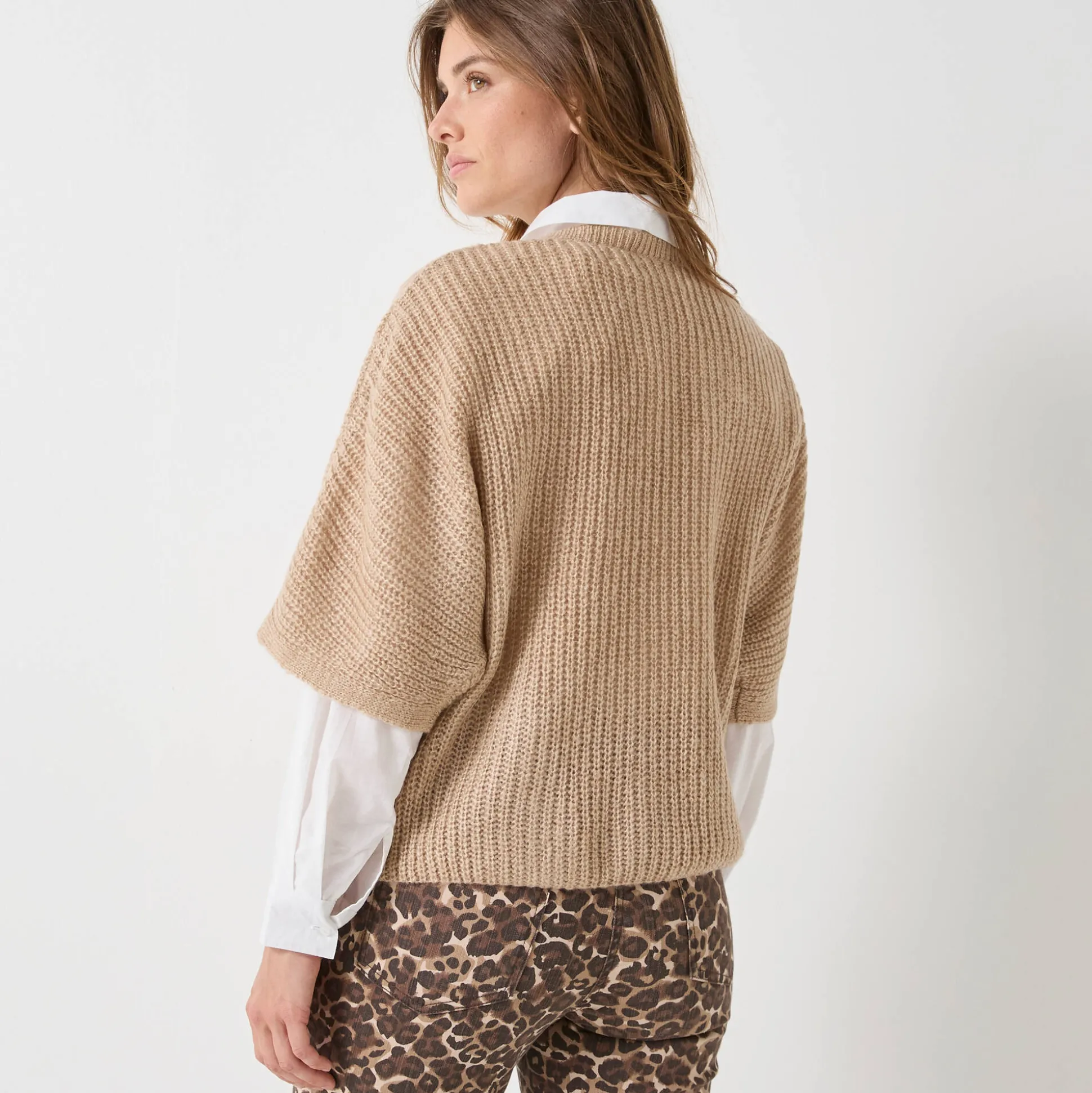 Poncho trui met mouwen op ellebooglengte