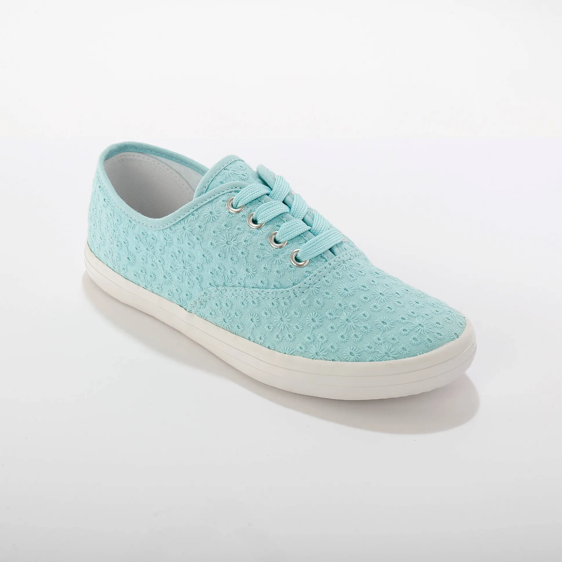 Sneakers in geborduurd canvas