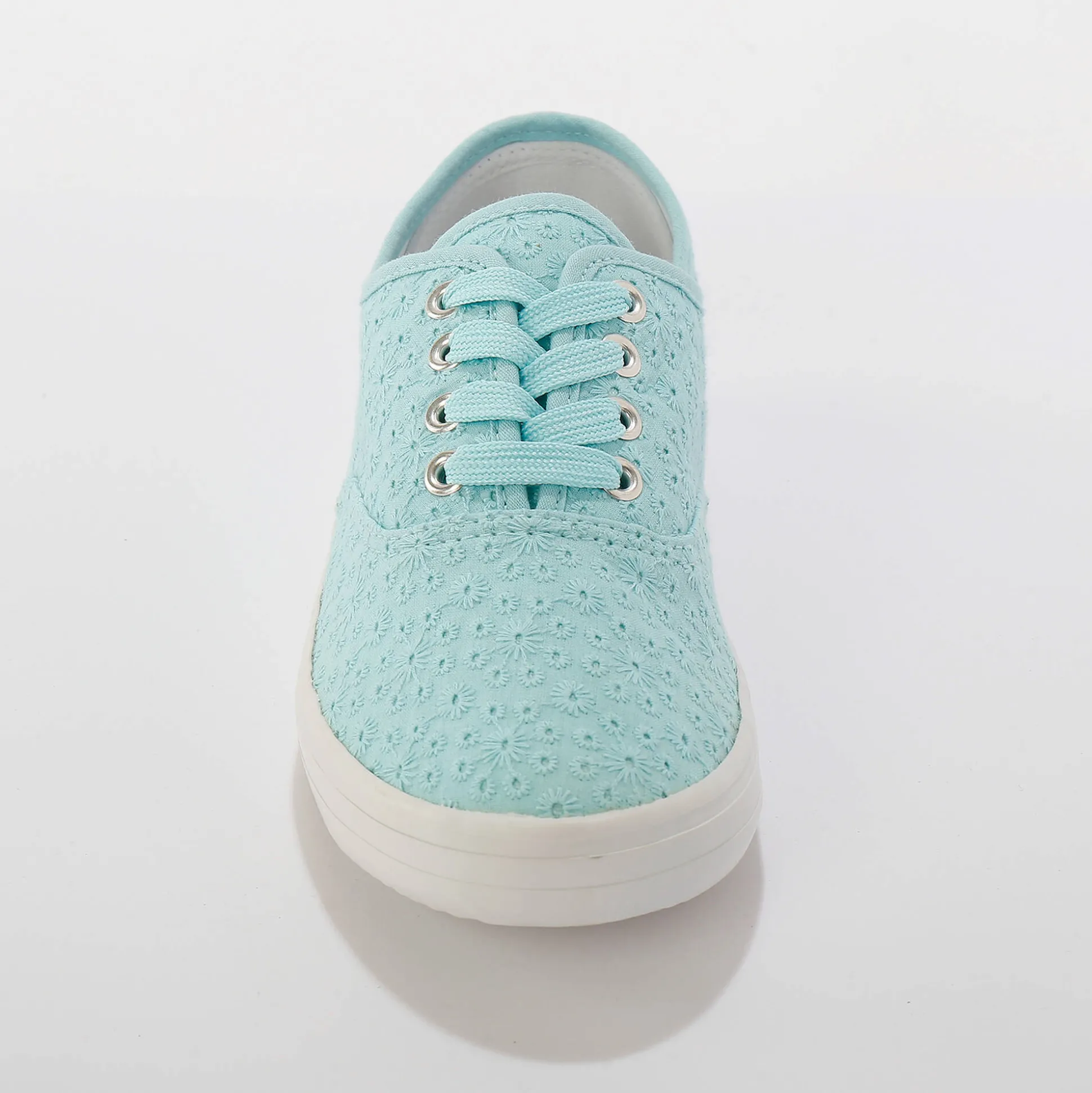 Sneakers in geborduurd canvas