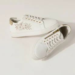 Sneakers met borduursel en rits