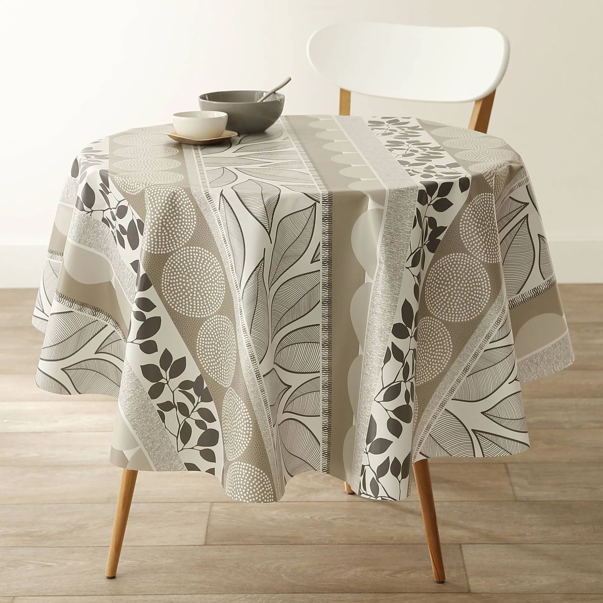 Tafellaken in toile cirée met bladeren- en tafellopereffect