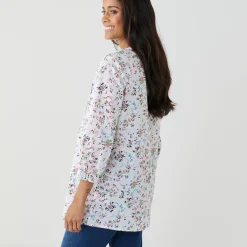 Tuniek met knopen, plooitjes en bloemenprint