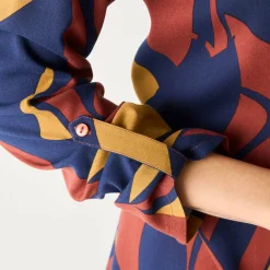Uitlopende tuniek met knopen en grafische print