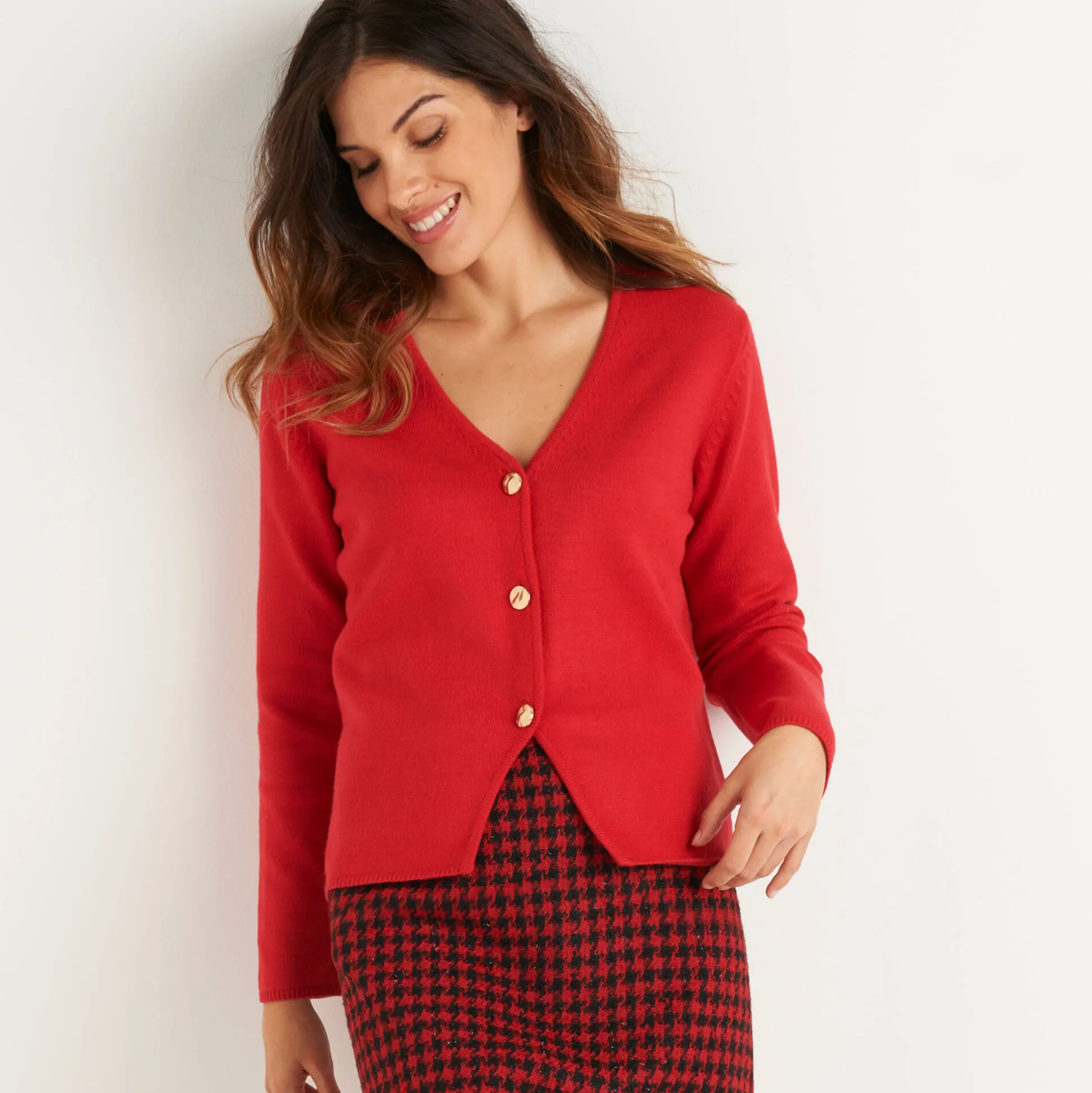 Vest met V-hals, knoopsluiting en asymmetrische onderkant